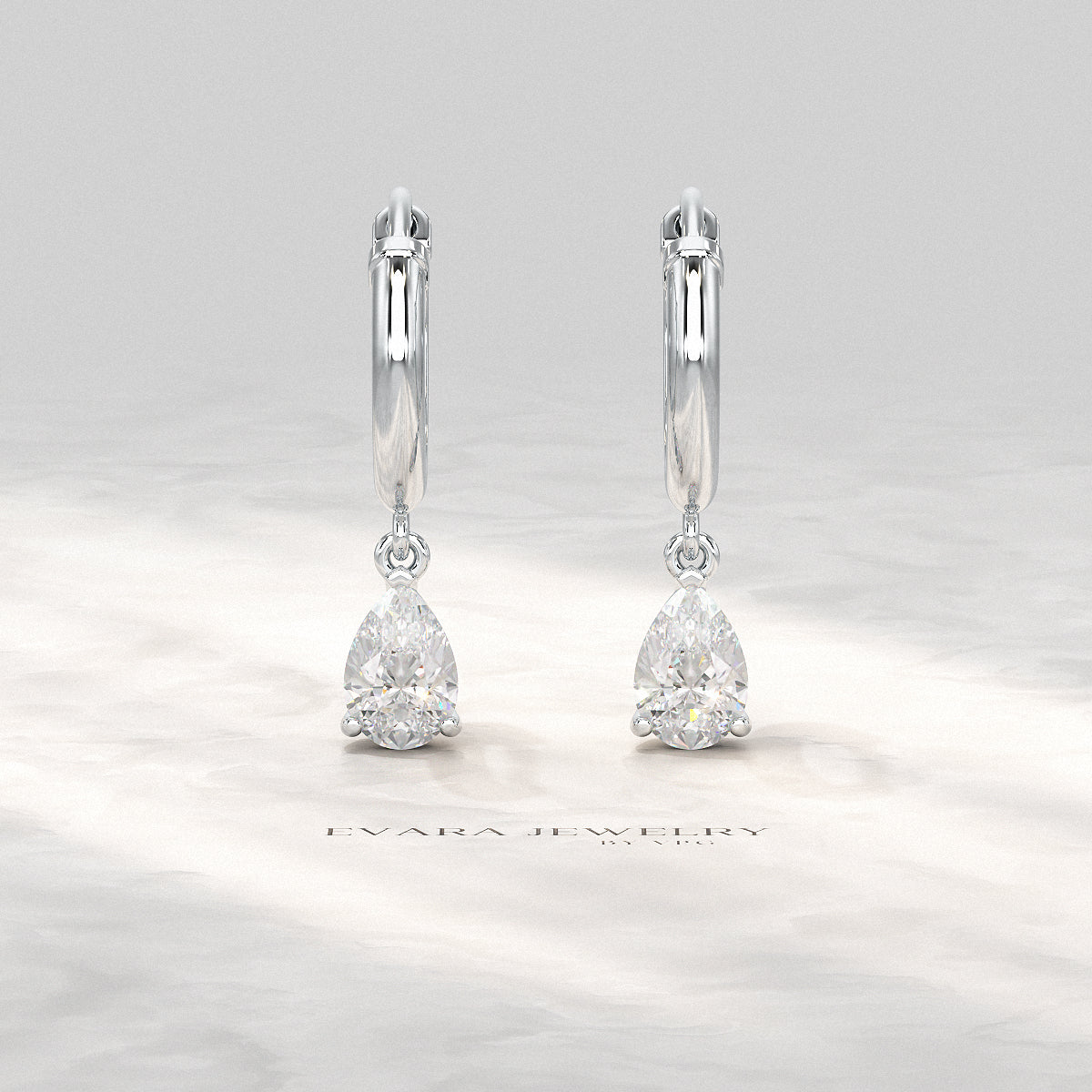 Sustainable pear-shaped diamond hoops for women