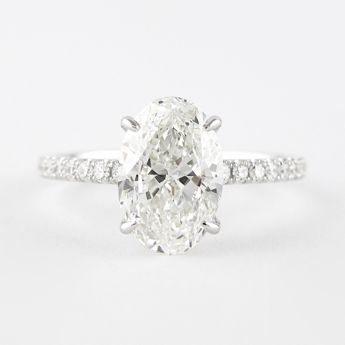 2.50 Carat Oval Cut Prong Set Lab Grown Diamond Engagement Ring with Pave Diamond Band