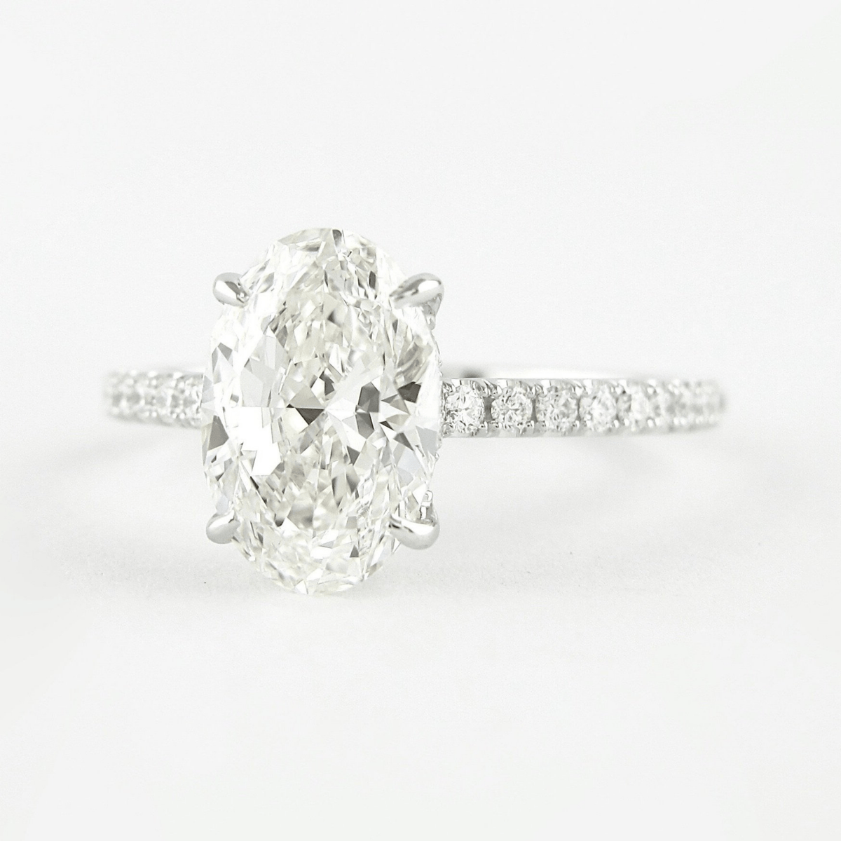 2.50 Carat Oval Cut Prong Set Lab Grown Diamond Engagement Ring with Pave Diamond Band - Evara Jewelry LLC
